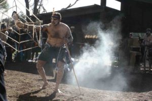 An Aboriginal man performing a ceremonial dance at the John Masters Bird Hide opening